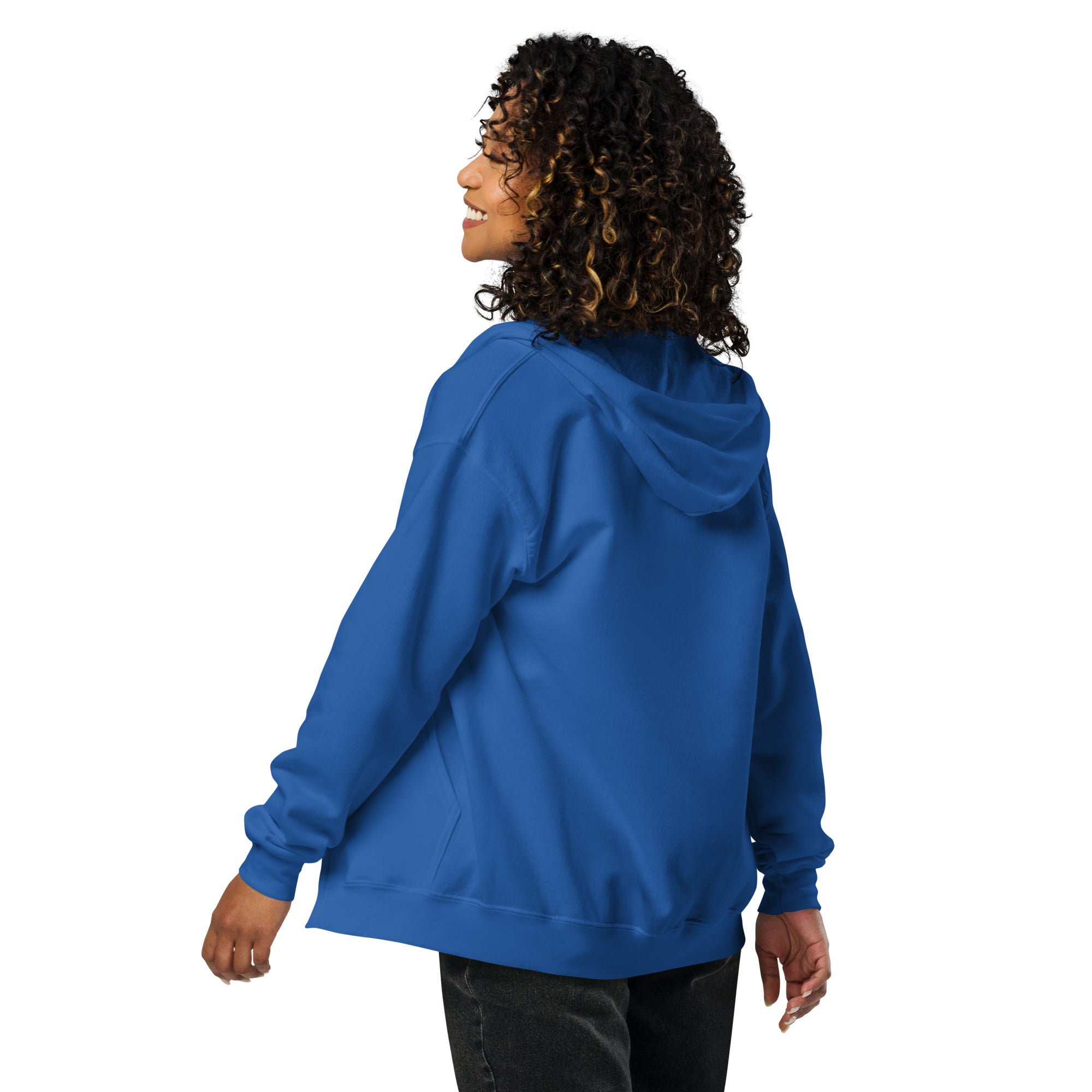 Woman wearing a blue heavy blend zip hoodie from the back, showcasing its cozy fit and style.
