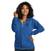 Woman wearing a blue zip hoodie with Ukrainian Tryzub design, soft fleece lining, showcasing style and Ukrainian heritage.