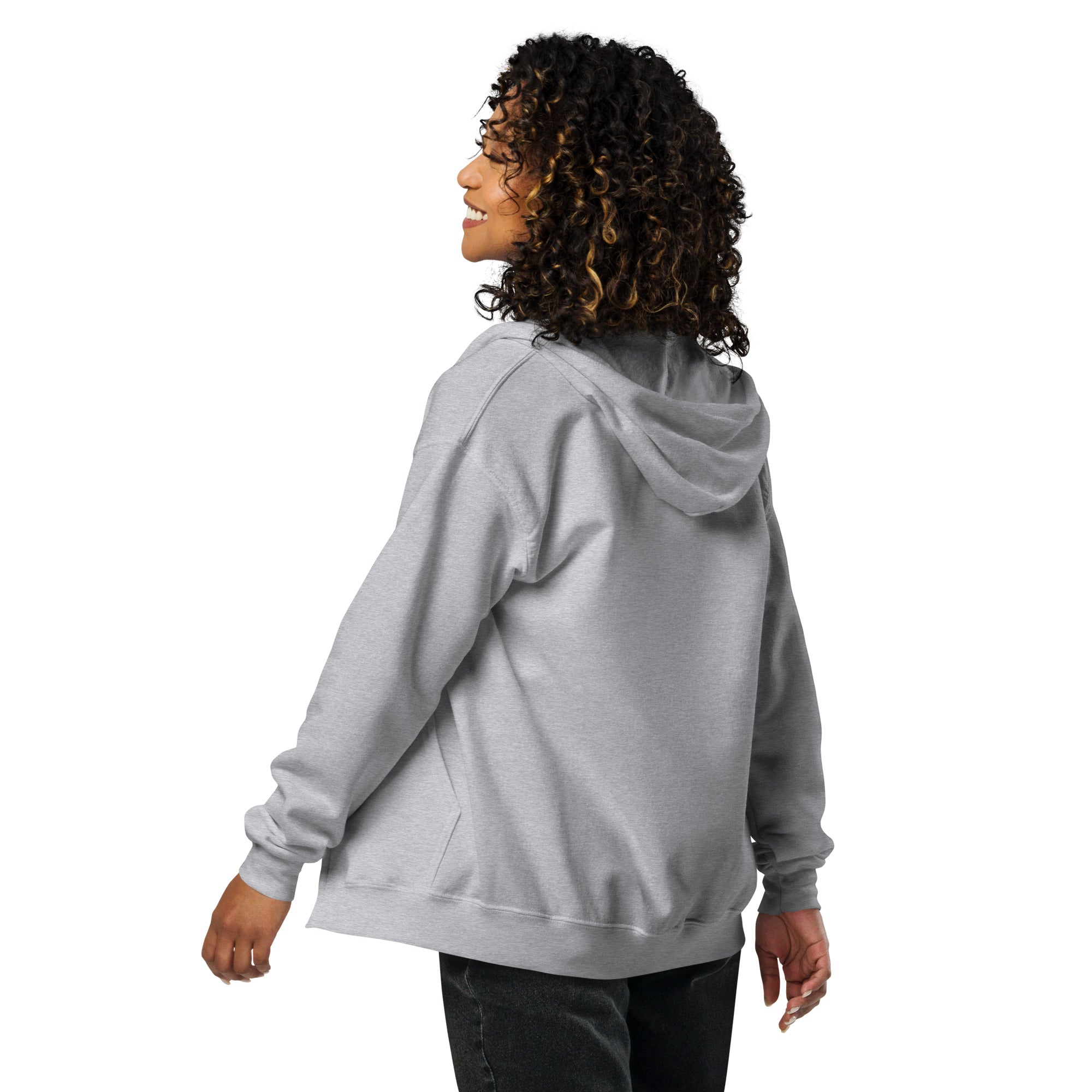 Woman wearing a cozy gray zip hoodie with Ukrainian Tryzub design, featuring soft fleece lining and tailored fit, shown from the back.