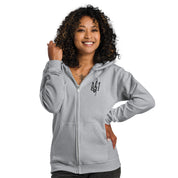 Woman wearing a gray zip hoodie with Ukrainian Tryzub design, showcasing cozy fleece lining and tailored fit.