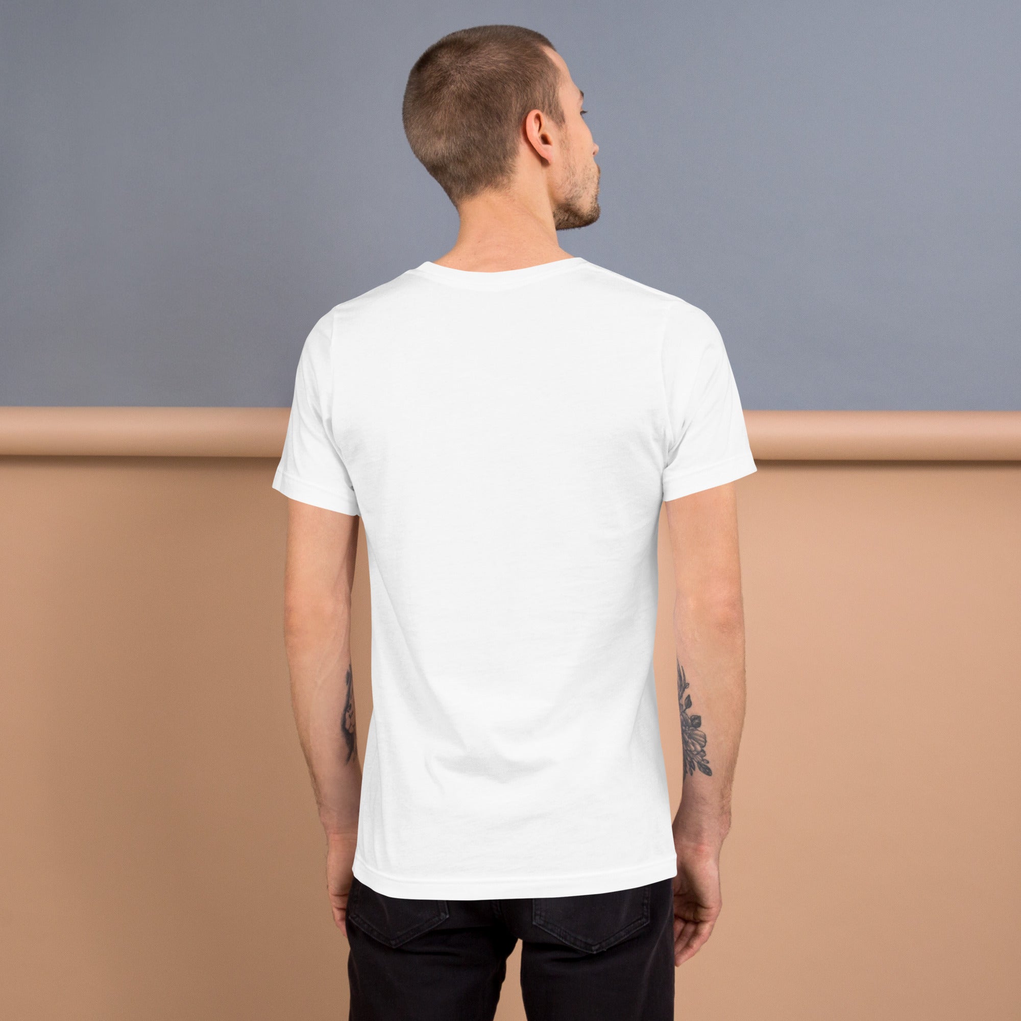 Man wearing white T-shirt with "Stop Putin" message, standing against beige and blue background, showcasing back view of the shirt