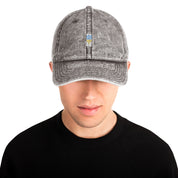Vintage unisex cotton twill cap with embroidered Ukrainian Tryzub design, featuring a washed-out effect and adjustable brass buckle.