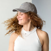 Woman wearing vintage unisex cotton twill cap with embroidered Ukrainian Tryzub, showcasing trendy and relaxed style.