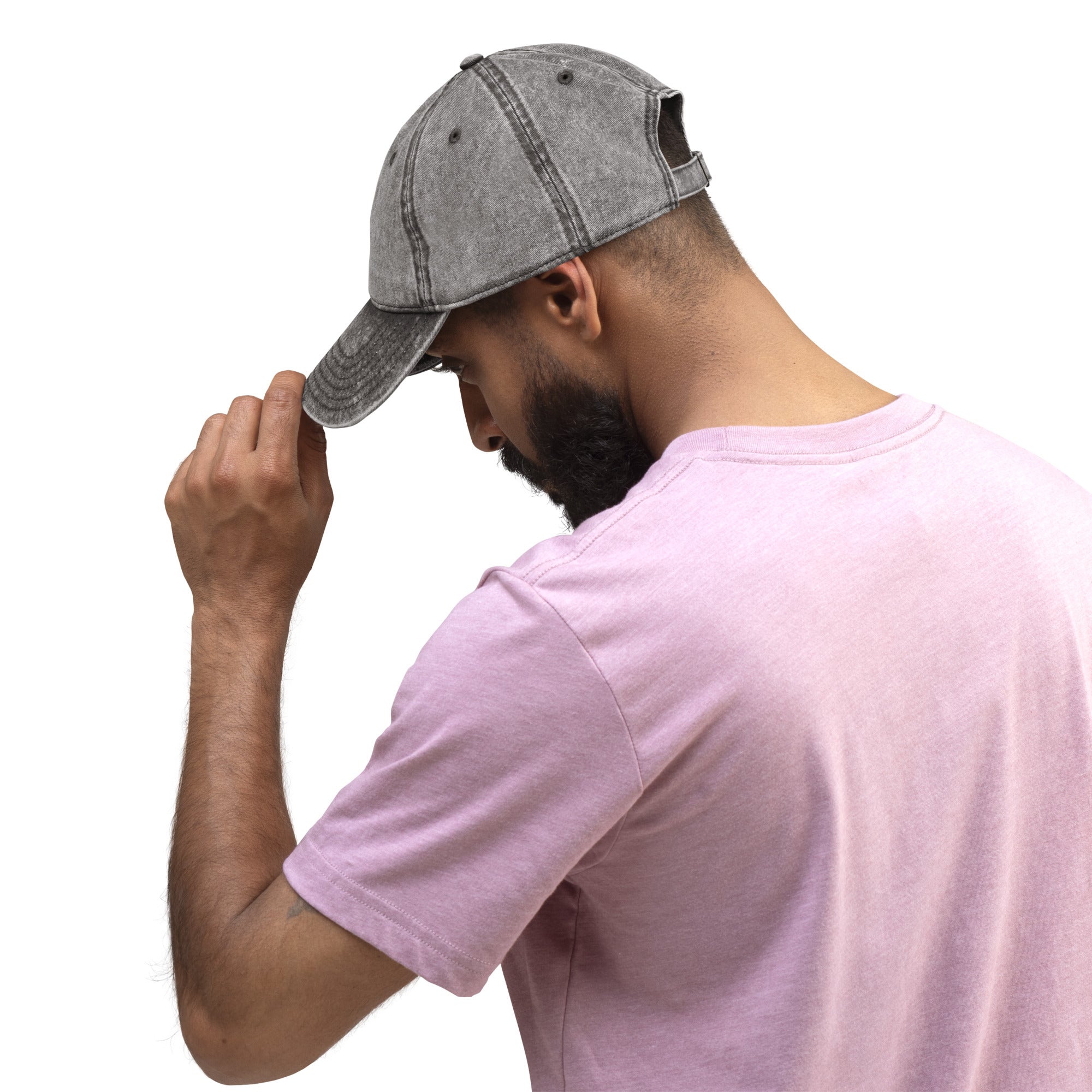 Man wearing vintage cotton twill cap with embroidered Ukrainian Tryzub, showcasing adjustable brass buckle and washed-out effect.