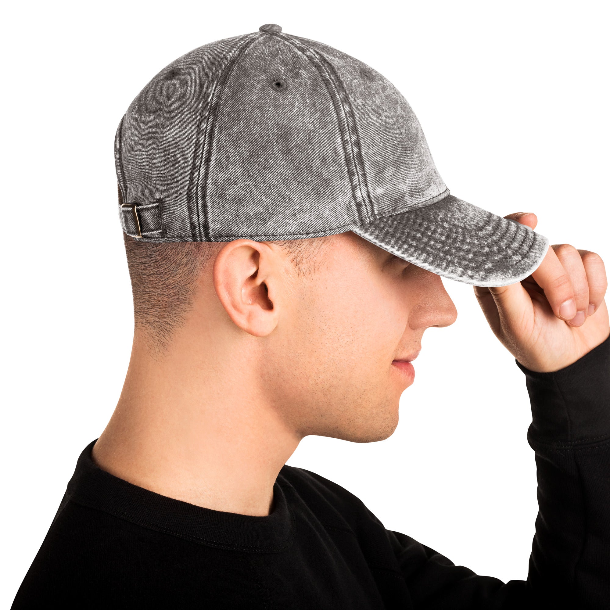 Vintage unisex cotton twill cap with embroidered Ukrainian Tryzub, adjustable brass buckle, worn by a person, side view.