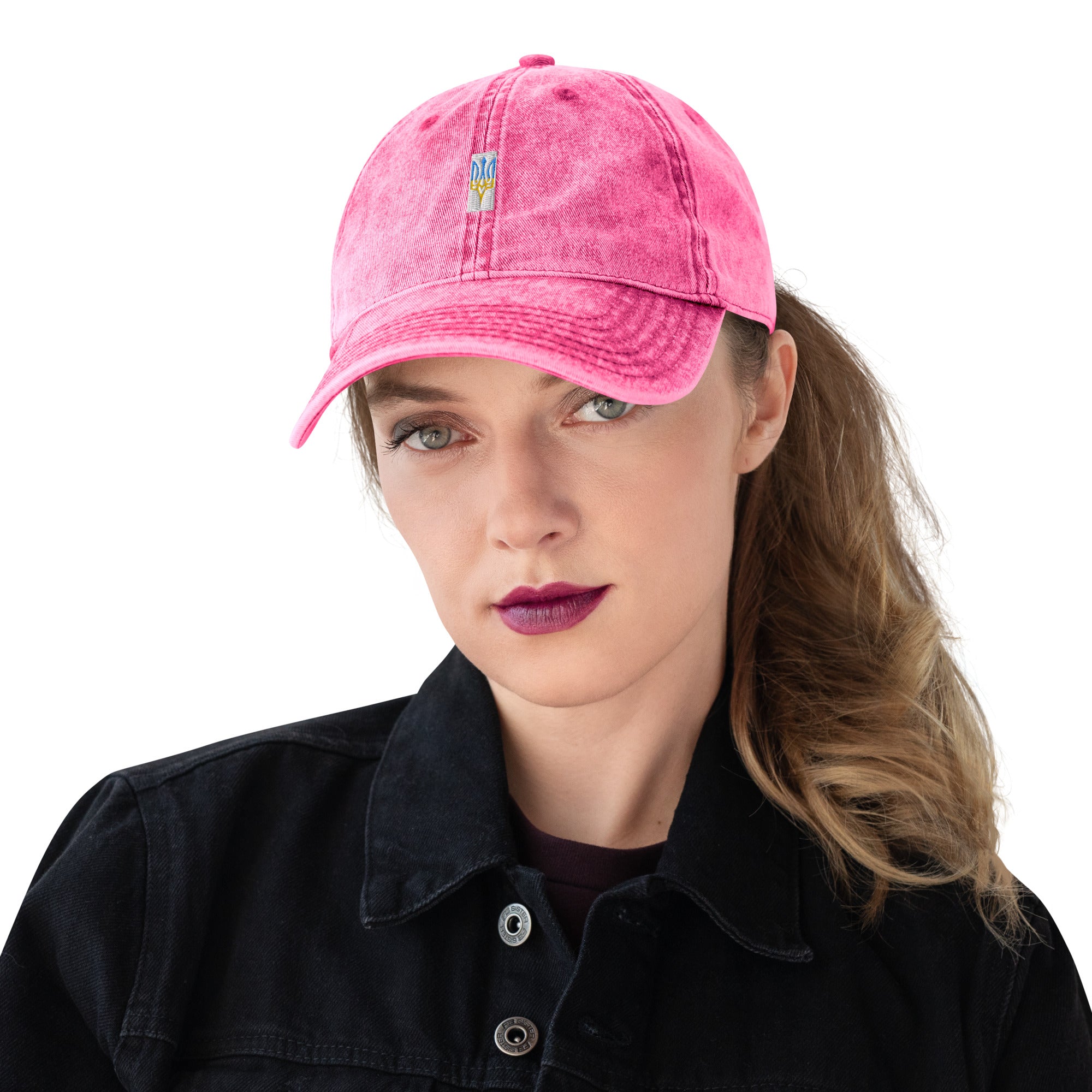 Vintage pink cotton twill cap with embroidered Ukrainian Tryzub on a model, showcasing its stylish and comfortable design.
