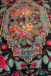 Vintage Moldovan black-green floral Kilim rug with vibrant roses, handwoven wool antique from 1970s Bessarabian collection.