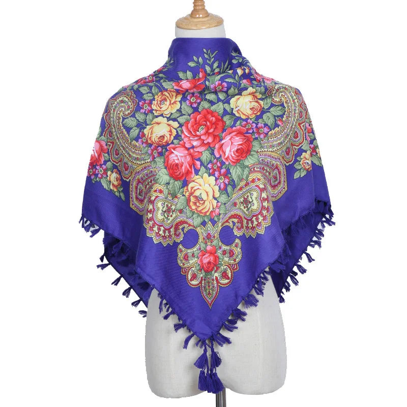 Vintage Ukrainian embroidered headscarf with floral design on a mannequin, featuring vibrant colors and traditional patterns.