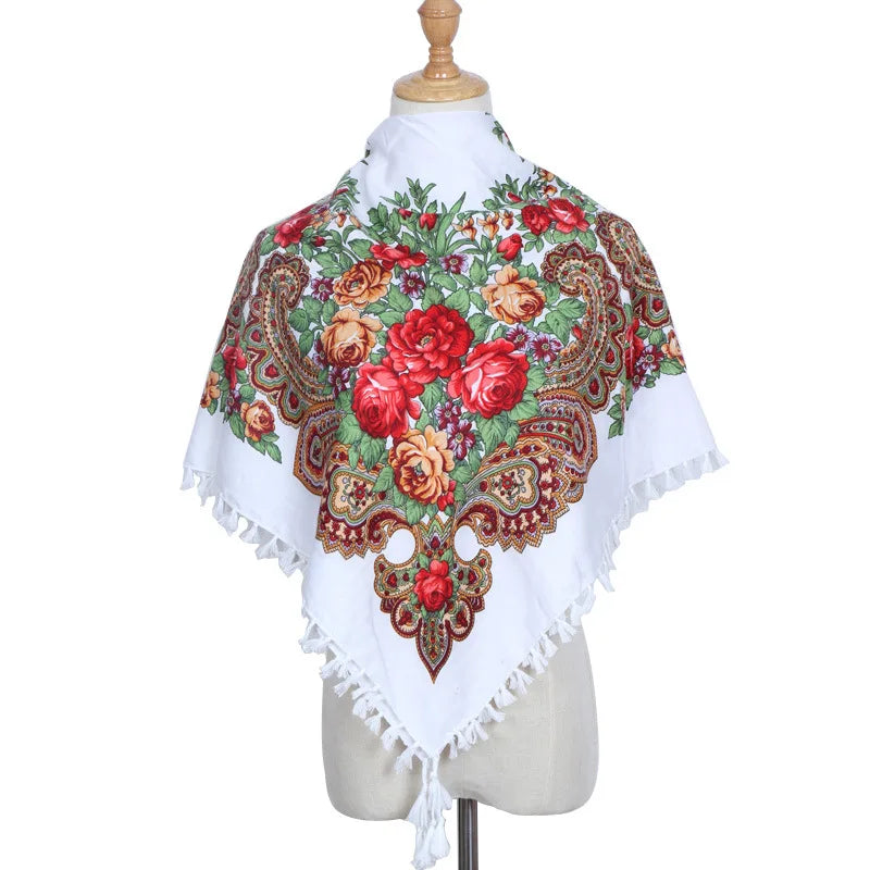 Vintage Ukrainian embroidered headscarf with floral design on mannequin.