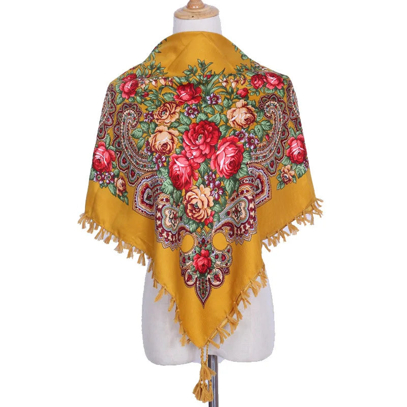 Vintage Ukrainian embroidered headscarf on mannequin, featuring colorful floral patterns on yellow fabric, showcasing cultural elegance.