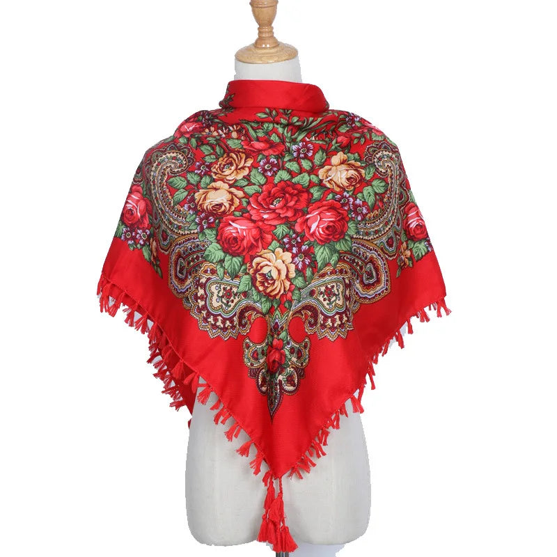 Vintage Ukrainian embroidered headscarf with red floral design on mannequin.