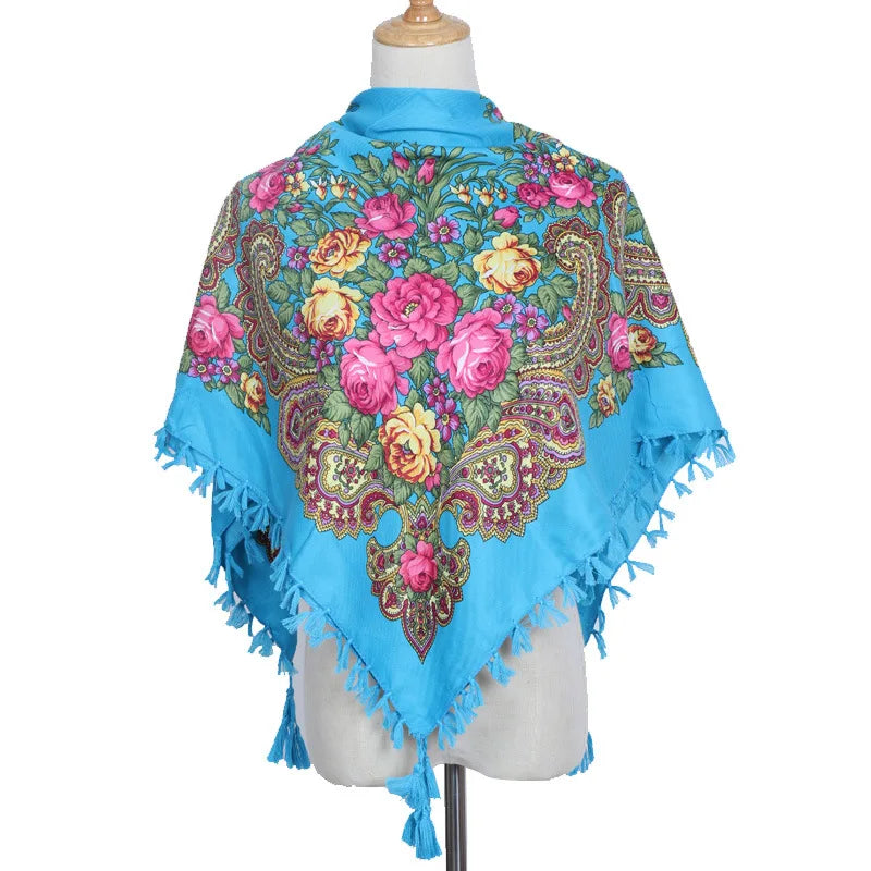 Vintage Ukrainian embroidered headscarf in blue with floral design displayed on mannequin.