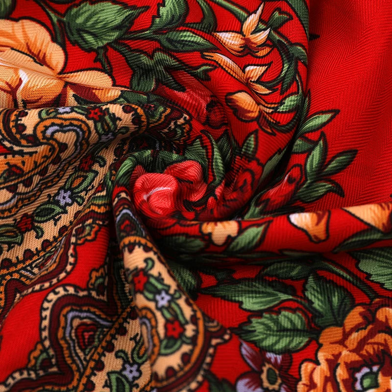 Vintage Ukrainian embroidered headscarf with floral design in vibrant red and orange colors, showcasing cultural elegance.
