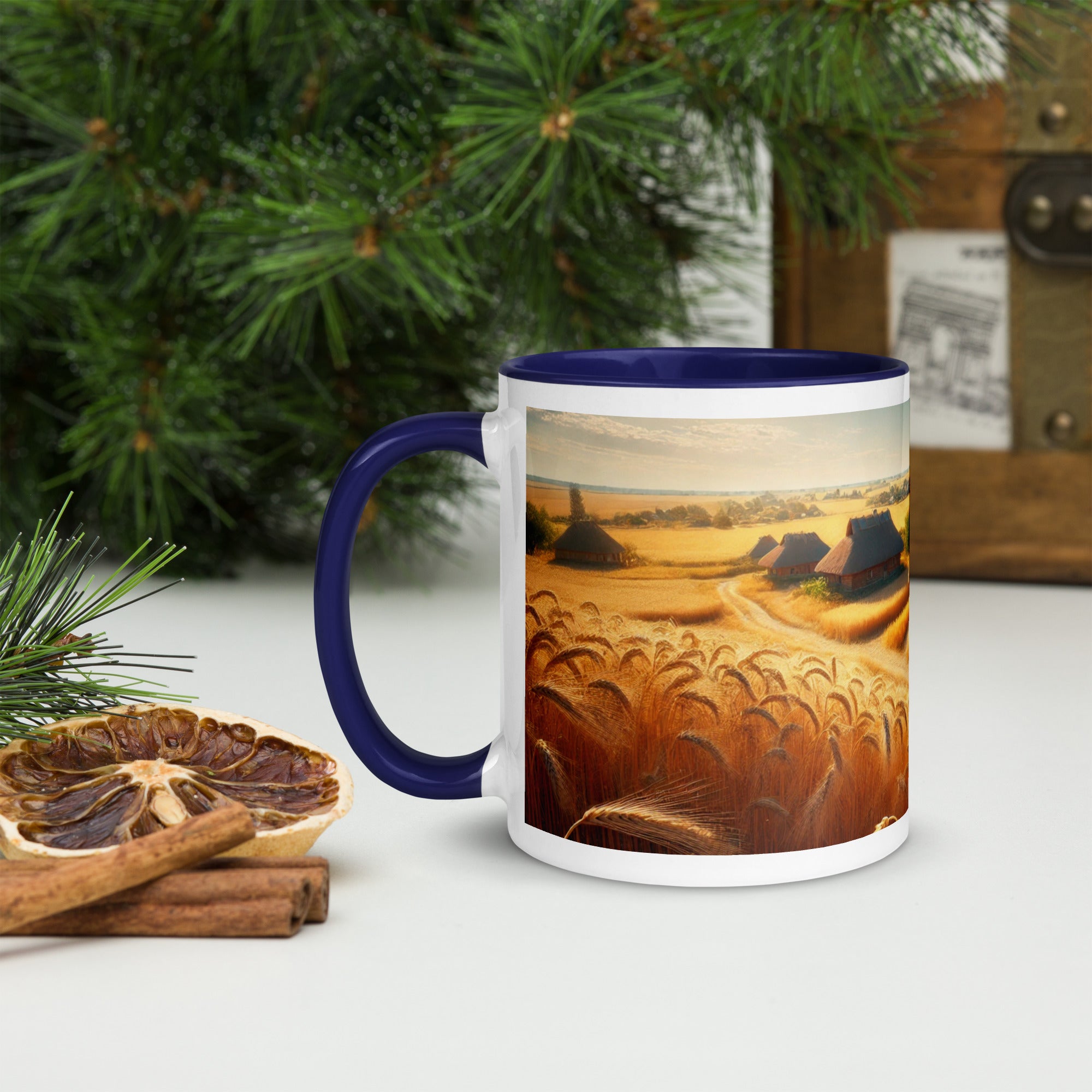 Ceramic mug with a Ukrainian cottage and wheat field design, featuring a blue rim and handle, on a table with pine decor.