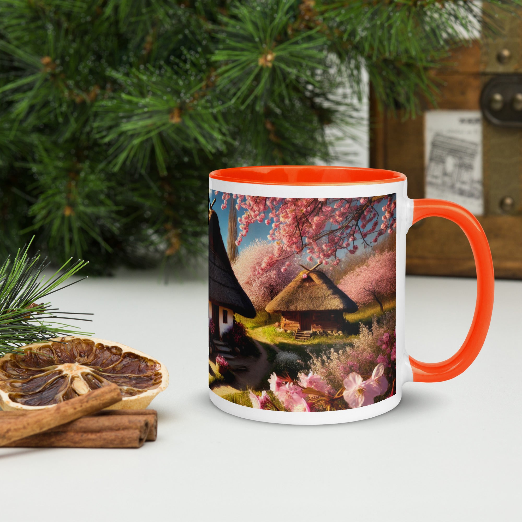 Ceramic mug with Ukrainian cottage and cherry orchard design, featuring vibrant orange details, perfect for tea or coffee.