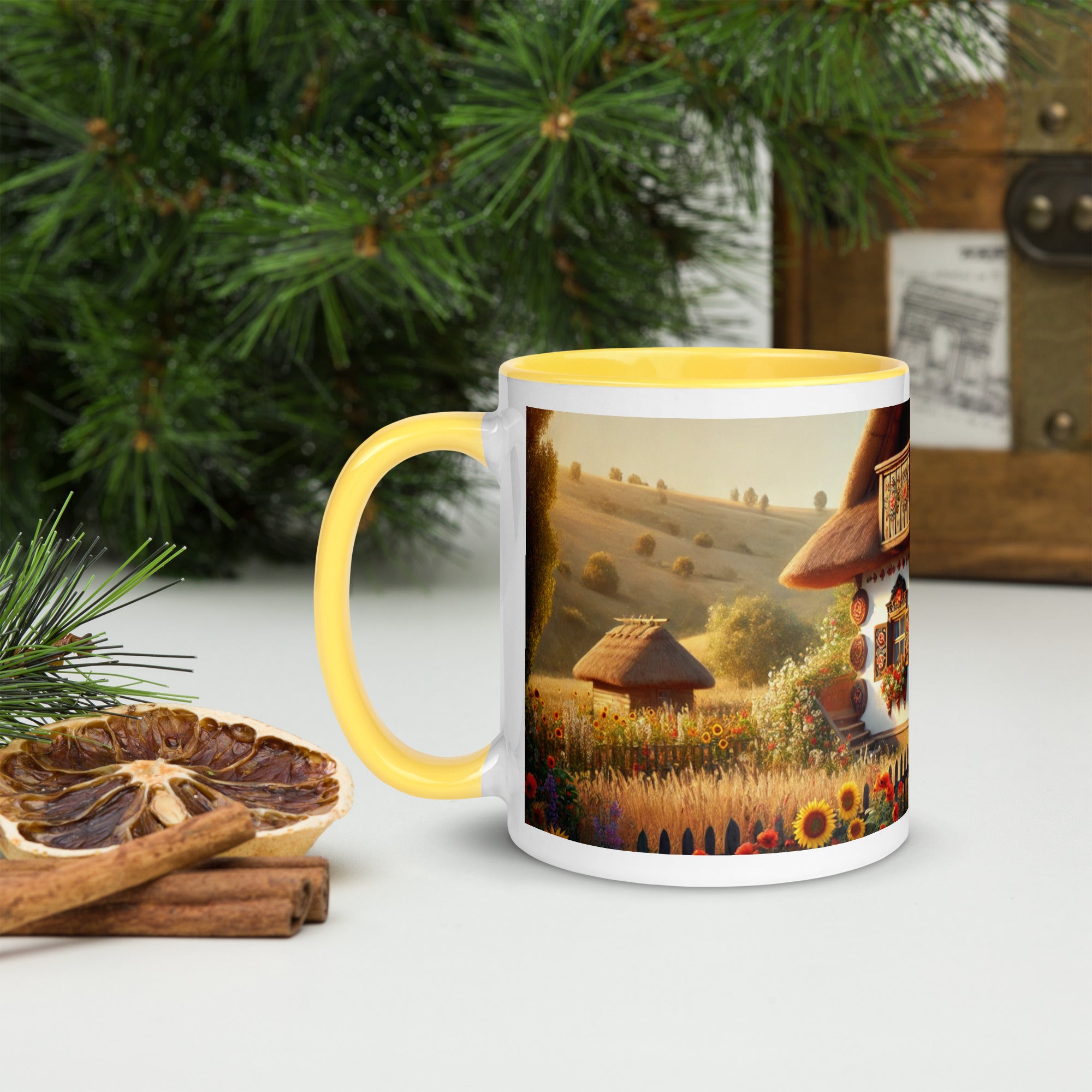 Ceramic mug with Ukrainian cottage and scenic yard design, featuring a yellow handle and interior, on a rustic table setting.