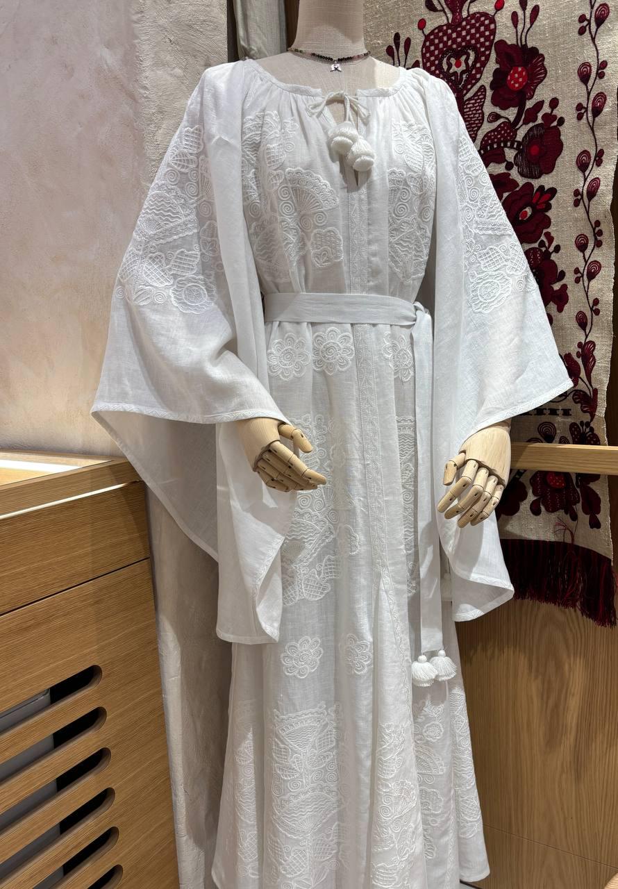 White linen wedding dress with Ukrainian embroidery in boho style, perfect for weddings or as a meaningful gift for her.