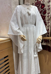 White linen wedding dress with Ukrainian embroidery in boho style, perfect for weddings or as a meaningful gift for her.