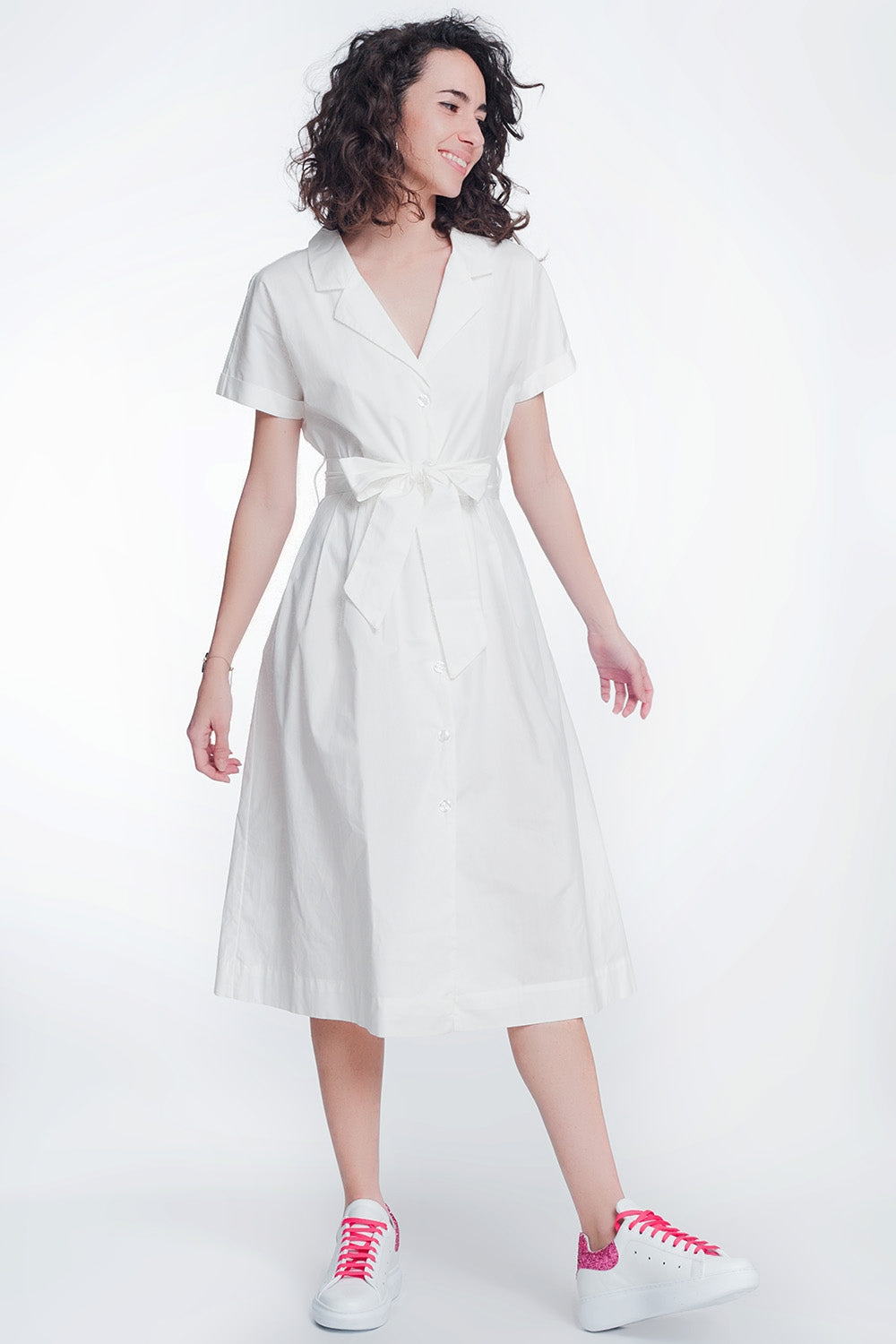Woman wearing Calviera Belted Poplin Shirt Dress with structured white cotton design and tailored collar.