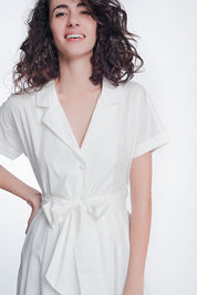 Woman wearing Calviera Belted Poplin Shirt Dress, structured white cotton dress with tailored collar and matching belt.