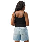 Woman wearing black micro-rib tank top and denim shorts, showcasing the back design of the Ukrainian Vibe Trizub Collection garment.