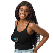 Woman wearing black Ukrainian Vibe Trizub Collection micro-rib tank top with vibrant design and blue jeans, smiling confidently.