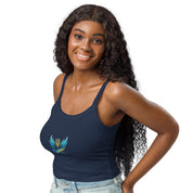Woman wearing Ukrainian Vibe Trizub Collection micro-rib tank top in navy blue with embroidered design, smiling indoors.