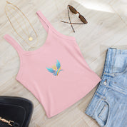 Pink micro-rib tank top from Ukrainian Vibe Trizub Collection with necklace, sunglasses, jeans, and bag on wooden floor.