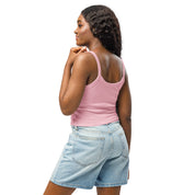 Woman wearing Ukrainian Vibe Trizub Collection micro-rib tank top in pink, paired with denim shorts, showing back view.