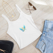 White micro-rib tank top with Ukrainian Vibe Trizub design, paired with jeans, sunglasses, necklace, and black bag on wooden floor.