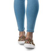 Woman wearing slip-on canvas shoes with colorful Ukrainian symbolic design, shown from the back for stylish and comfortable fit.