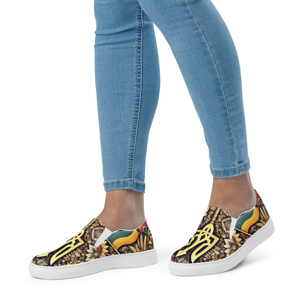 Women's slip-on canvas shoes with Ukrainian symbolic design, colorful pattern, worn with jeans.
