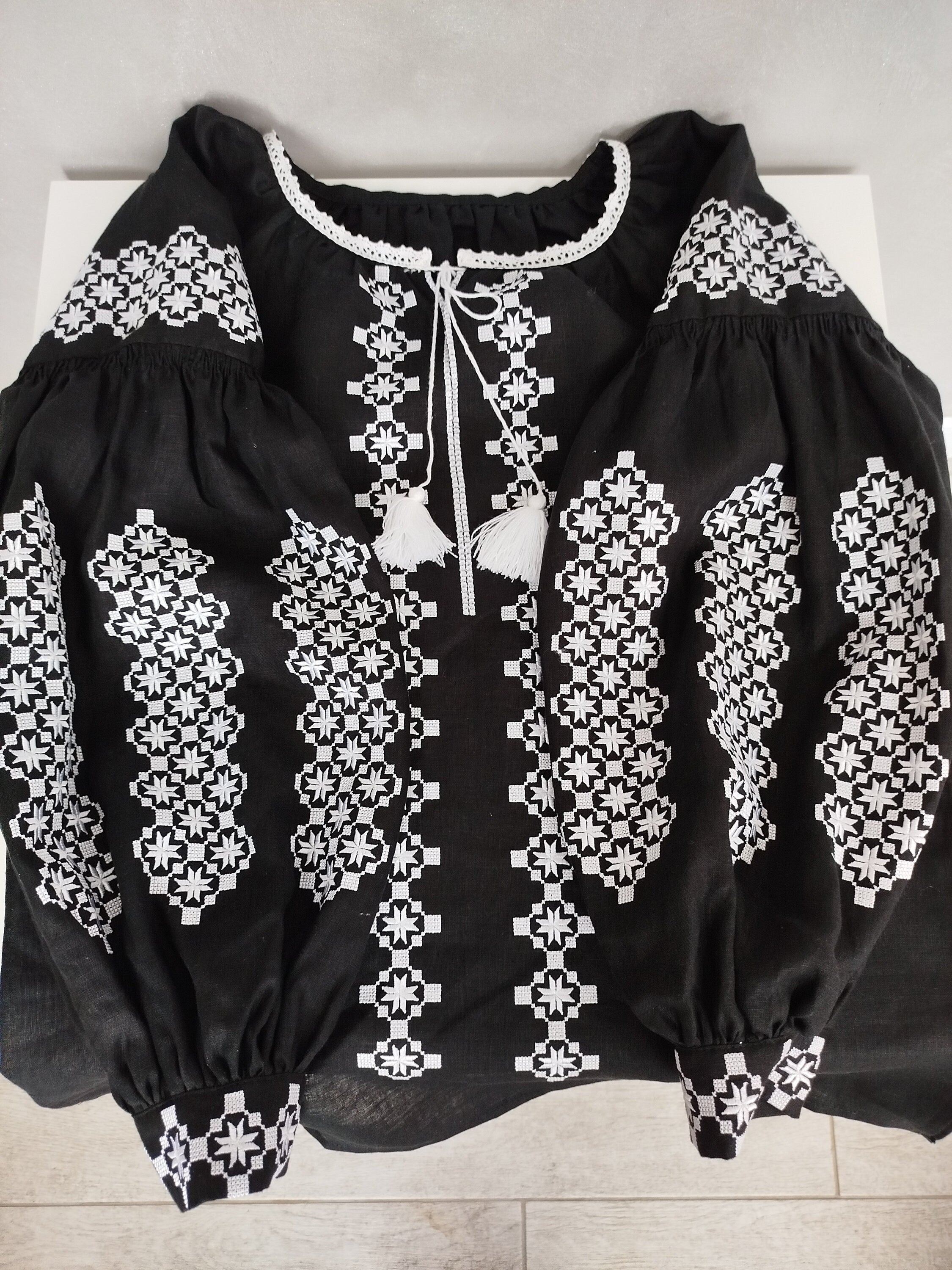 Women's Ukrainian Vyshyvanka - Black blouse with white embroidery, traditional folk design, on homespun fabric.