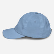 Youth blue baseball cap with Ukrainian Tryzub emblem, featuring an adjustable strap and breathable eyelets for active kids.