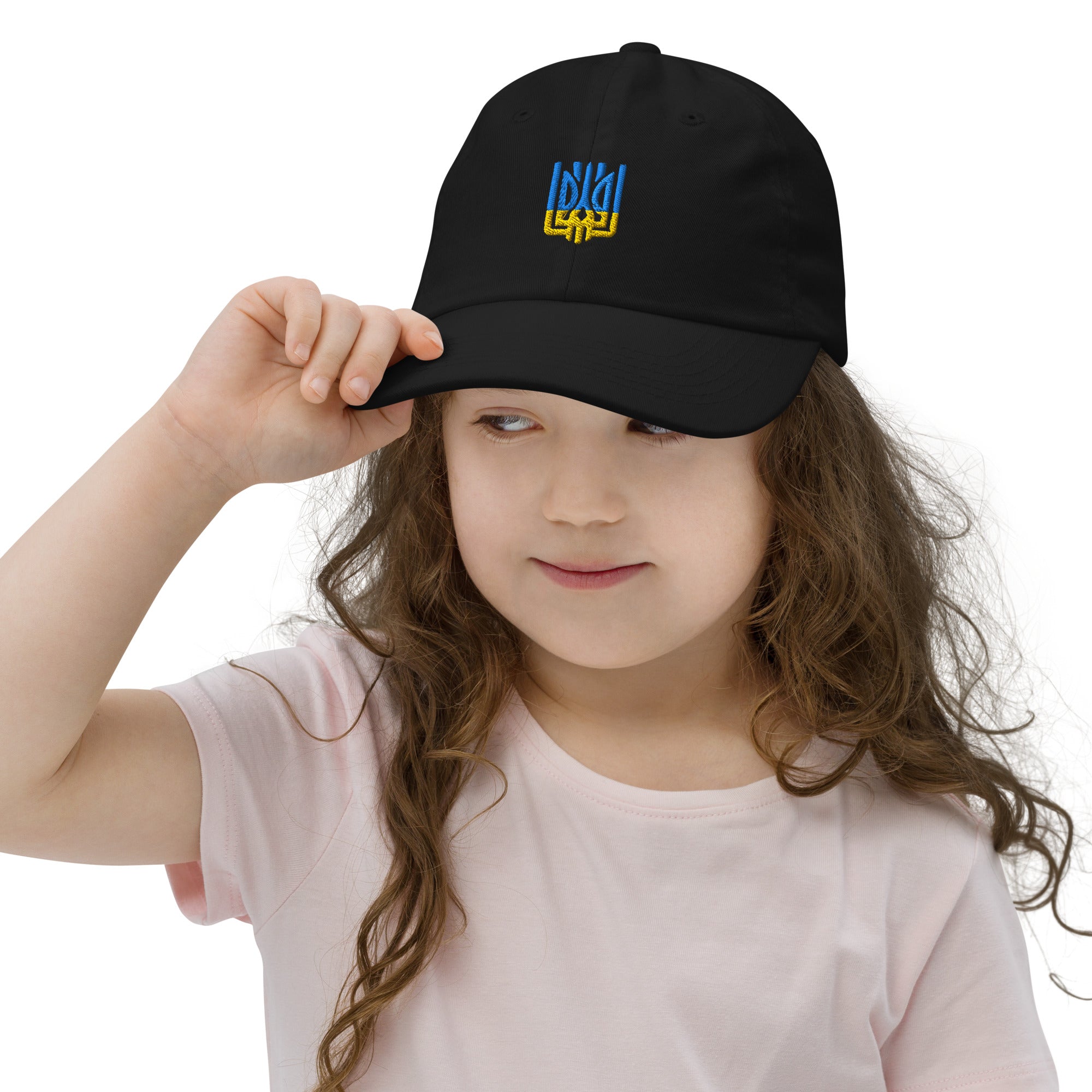 Child wearing a black youth baseball cap with Ukrainian Tryzub emblem, designed for comfort and breathability, perfect for active kids.