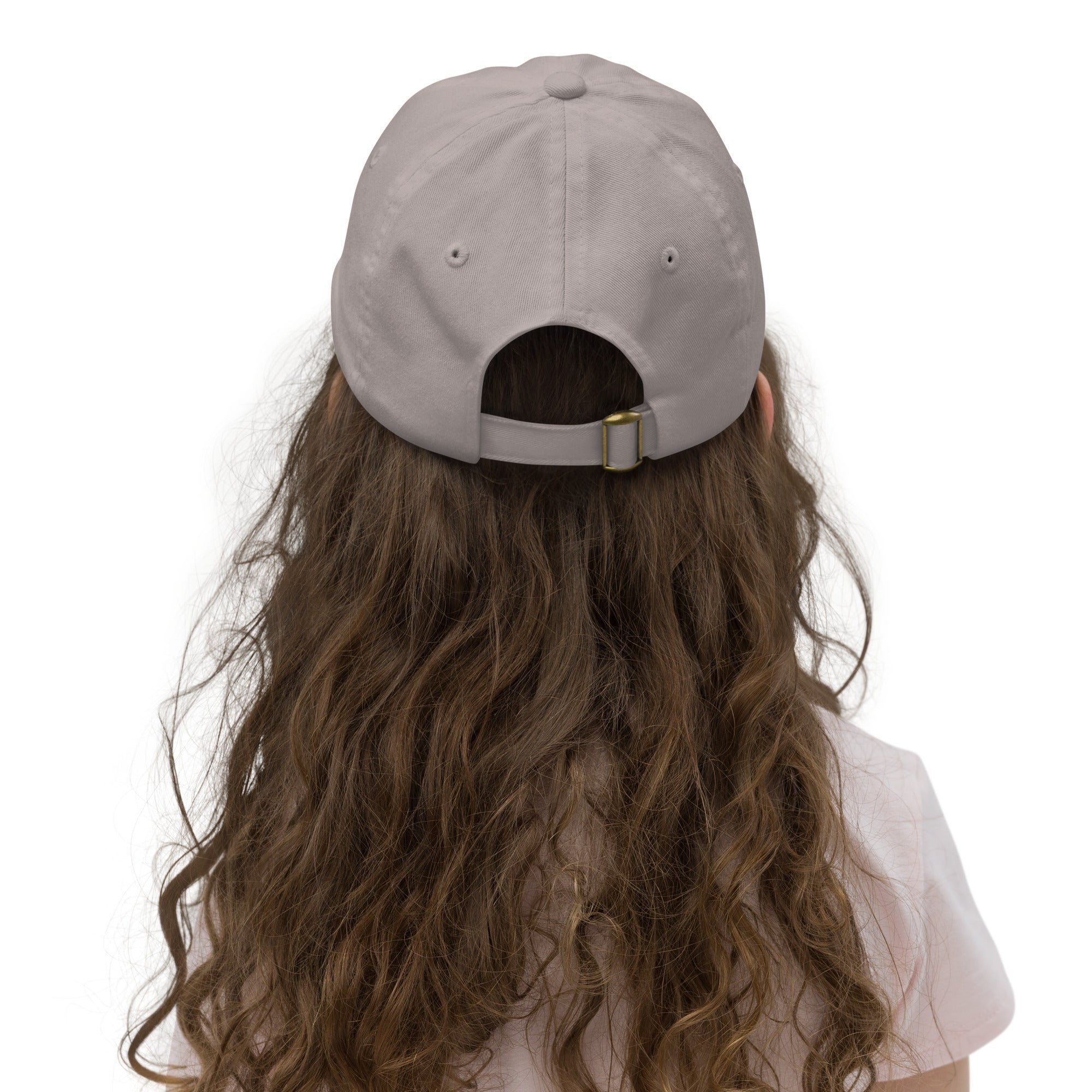 Back view of youth baseball cap with adjustable strap worn by child, ideal for outdoor activities, features Ukrainian Tryzub emblem.