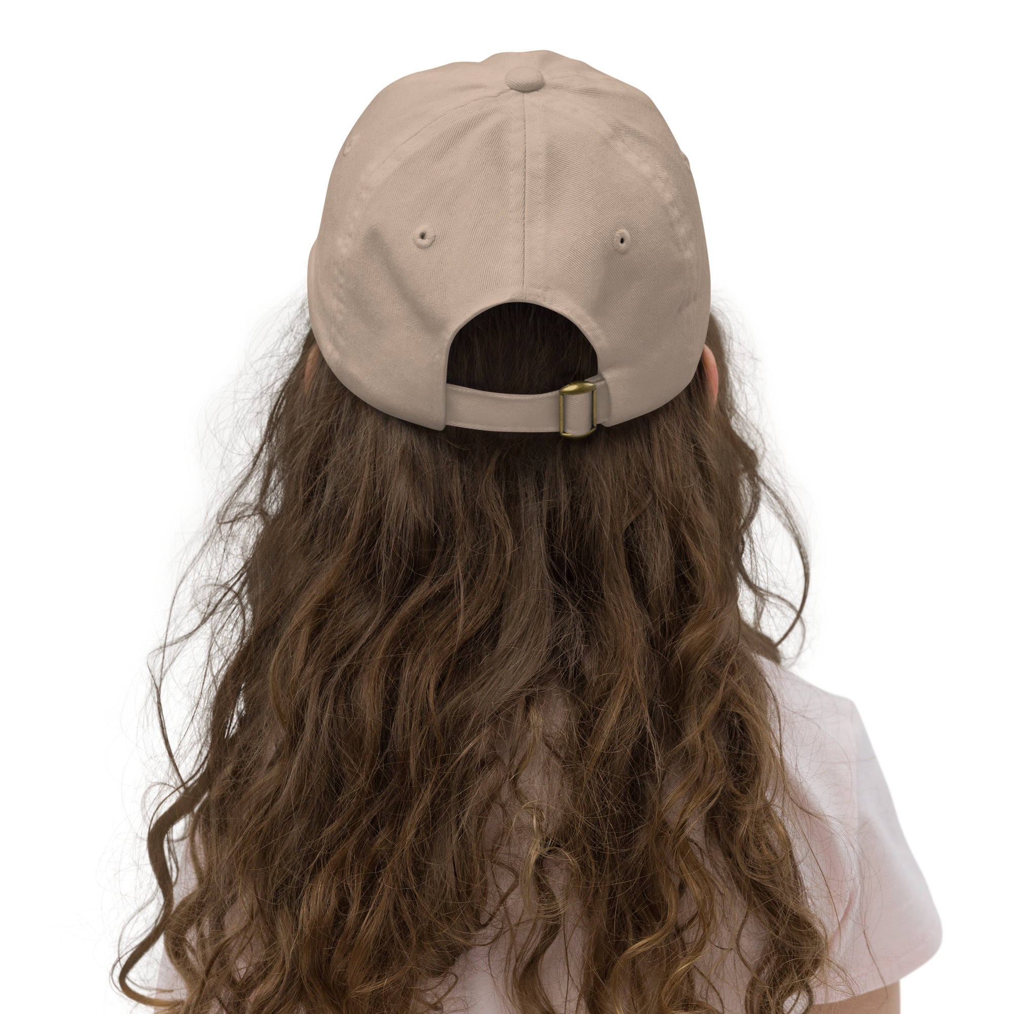 Back view of youth wearing adjustable beige baseball cap with buckle, showcasing breathable design and comfort for kids.
