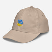 Youth baseball cap with Ukrainian Tryzub emblem in beige, made from bio-washed chino cotton, featuring six eyelets and adjustable strap for kids.