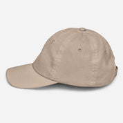 Youth baseball cap in beige with breathable design and Ukrainian Tryzub emblem, adjustable strap, ideal for active kids' sports and outdoor activities.