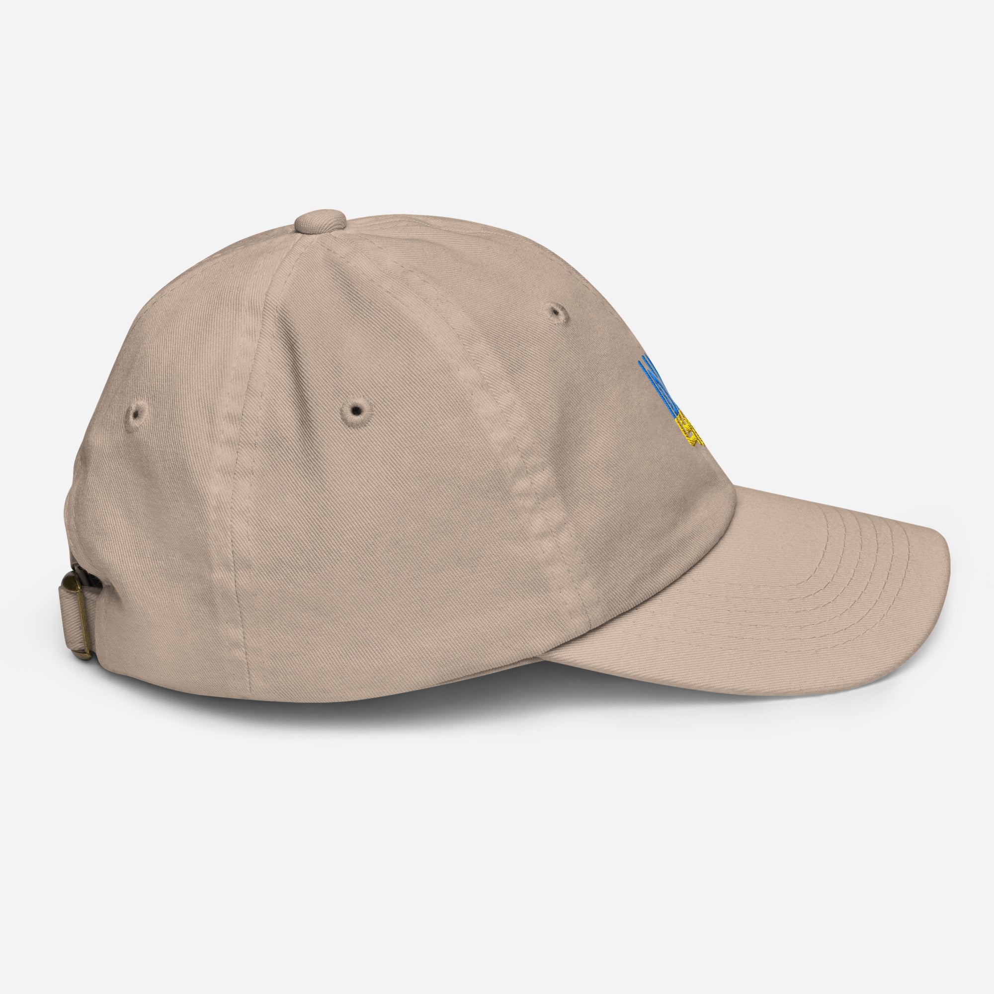 Youth baseball cap with Ukrainian Tryzub emblem, adjustable strap, and ventilation eyelets, ideal for active kids, side view.