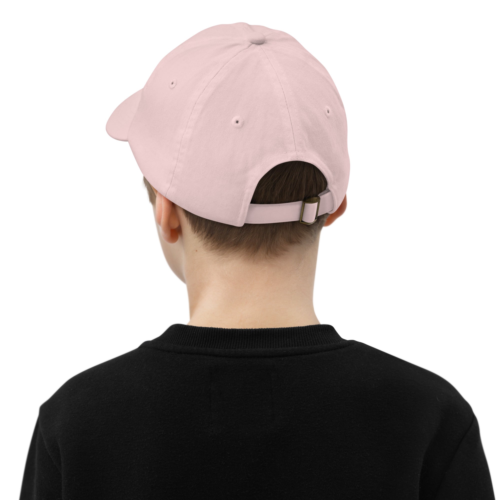Back view of child wearing adjustable youth baseball cap in pink with Tryzub emblem, demonstrating strap and ventilation design.