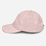 Youth baseball cap with Ukrainian Tryzub, side view. Bio-washed chino cotton twill, adjustable strap, six ventilation eyelets.