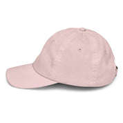 Side view of youth baseball cap with Ukrainian Tryzub, breathable pink cotton, adjustable strap, ideal for kids' sports or outdoor activities.