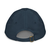 Back view of youth baseball cap in navy blue featuring an adjustable strap for a custom fit, made from bio-washed chino cotton twill.