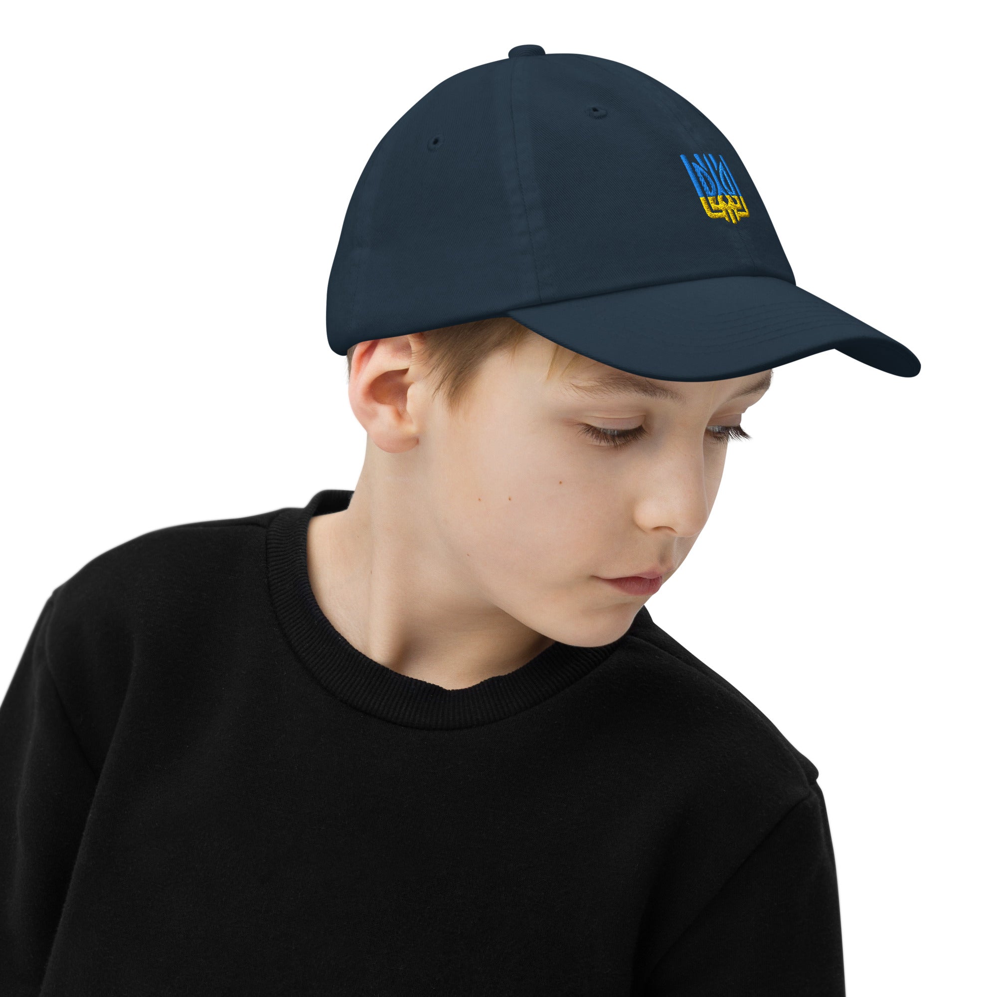 Youth baseball cap with Ukrainian Tryzub, breathable and adjustable, worn by a child. Ideal for active kids, featuring a stylish and patriotic design.