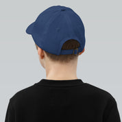 Rear view of child wearing blue adjustable youth baseball cap, featuring Ukrainian Tryzub emblem. Ideal for active outdoor wear.