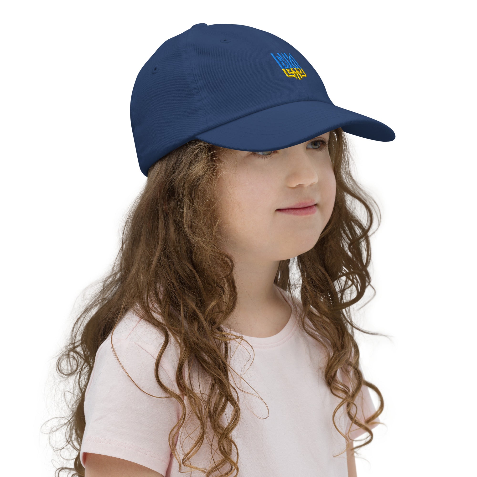 Child wearing blue youth baseball cap with Ukrainian Tryzub, adjustable fit, ideal for active kids and outdoor play.