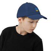Child wearing youth baseball cap with Ukrainian Tryzub, breathable and adjustable, ideal for outdoor activities and sports practice, navy blue.