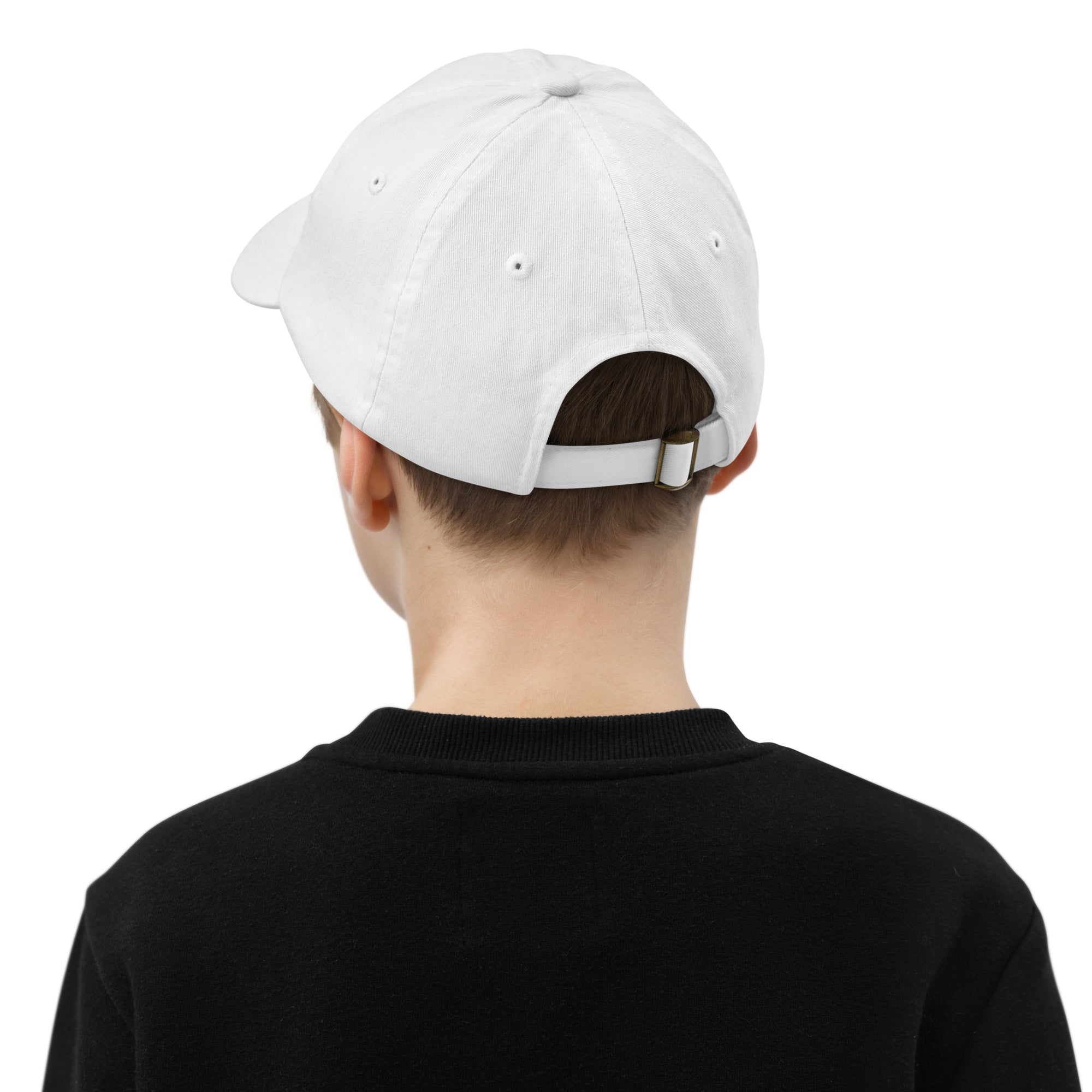 Back view of a youth wearing a white baseball cap with an adjustable strap and ventilation eyelets, shown on a child wearing a black shirt.