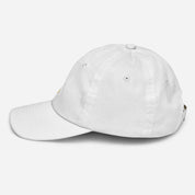 Side view of a white youth baseball cap with Ukrainian Tryzub, breathable and adjustable for active kids, made from bio-washed chino cotton twill.